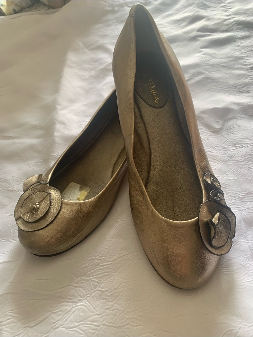 Cole Haan Women's Metallic Gold Ballet Flats with Floral Accent. Size 7B.